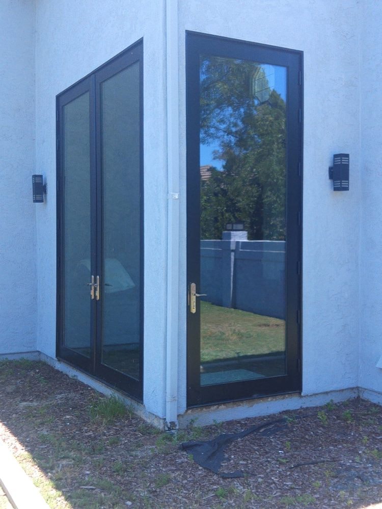 Elegant entry door installation on a luxury home